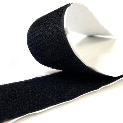 A roll of black self-adhesive interlocking hook and loop tape, 38mm wide.